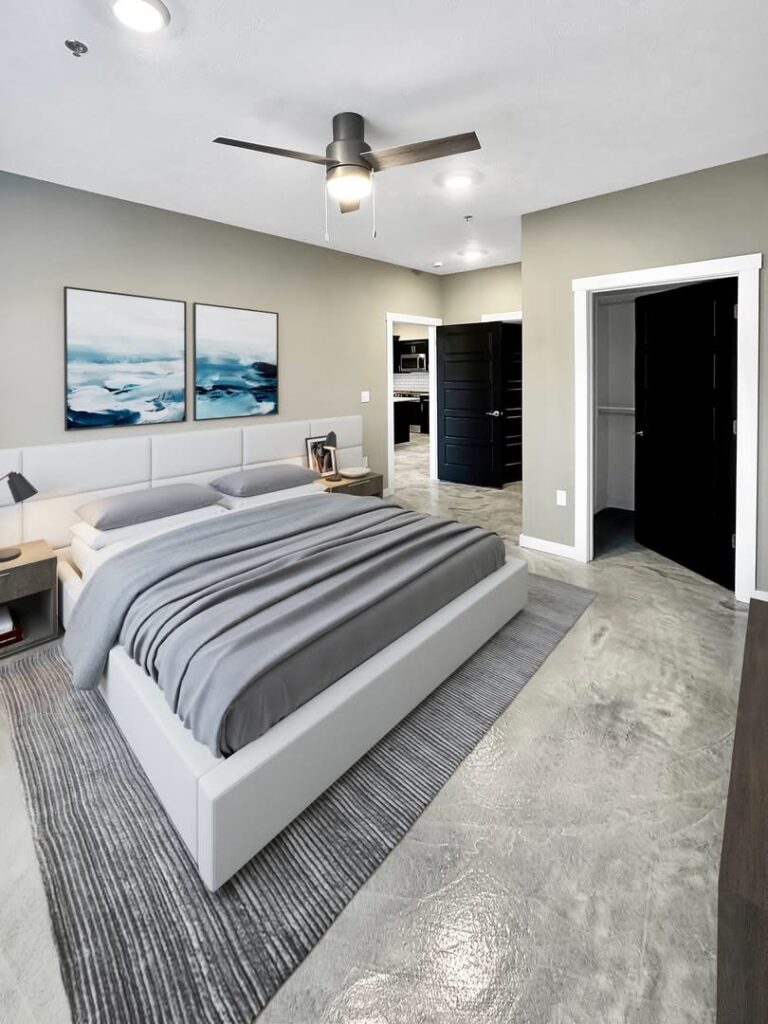Seamless FlowStone Flooring system with a smooth gray finish and natural stone texture in a modern multi-family space.